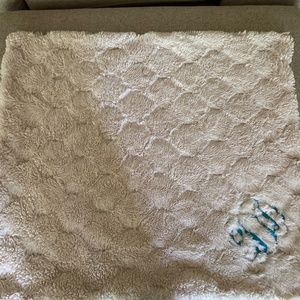White blanket with blue monogram